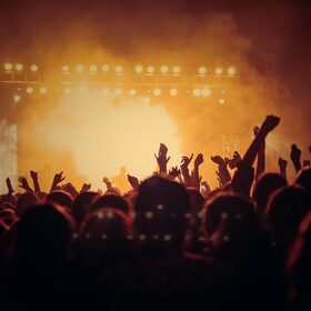 Concert stage lights and crowd for Ticket Boat